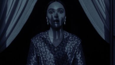 a clawed hands shadow covers lily rose depp in nosferatu.jpg